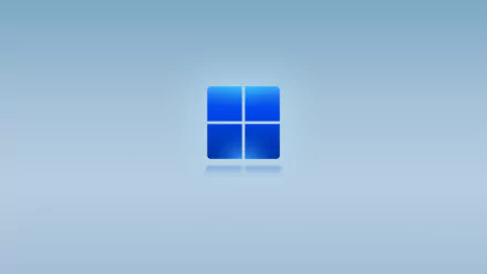 4K Ultra HD blue gradient desktop wallpaper featuring the default Windows 11 logo centered on a smooth technology-themed background.
