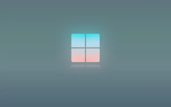 4K Ultra HD desktop wallpaper showcasing a minimalist Windows 11 logo with soft blue and pink gradient on a smooth gray background.