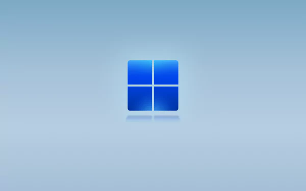 4K Ultra HD blue gradient desktop wallpaper featuring the default Windows 11 logo centered on a smooth technology-themed background.