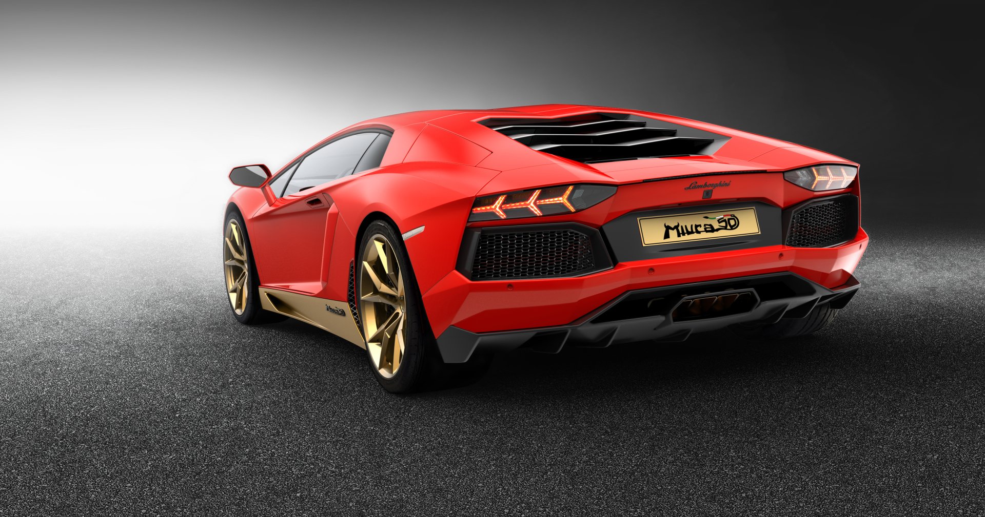 Red Lamborghini Aventador LP 700-4 supercar, rear three-quarter view with gold wheels on dark pavement — 2K Quad HD PC desktop wallpaper/background.