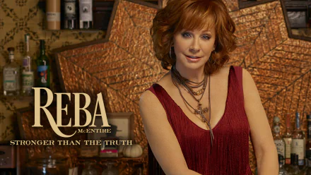 HD desktop wallpaper featuring a person with red hair, in a burgundy top, posing in front of a bar backdrop with text overlay.