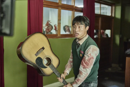 Bloodied student grips an acoustic guitar like a weapon in a tense school hallway — TV show All of Us Are Dead, 2K Quad HD PC desktop wallpaper and background.