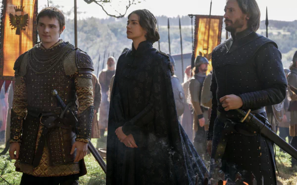 HD PC desktop wallpaper of three armored figures from the TV show Vikings: Valhalla standing in a camp, cloaks and swords glinting in filtered light.