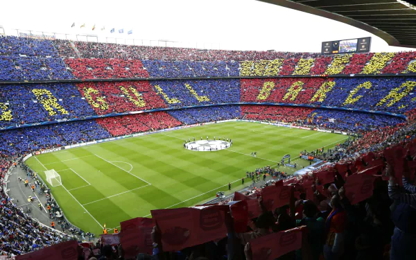 HD PC wallpaper of FC Barcelona’s stadium filled with fans displaying a colorful mosaic during a sports event.