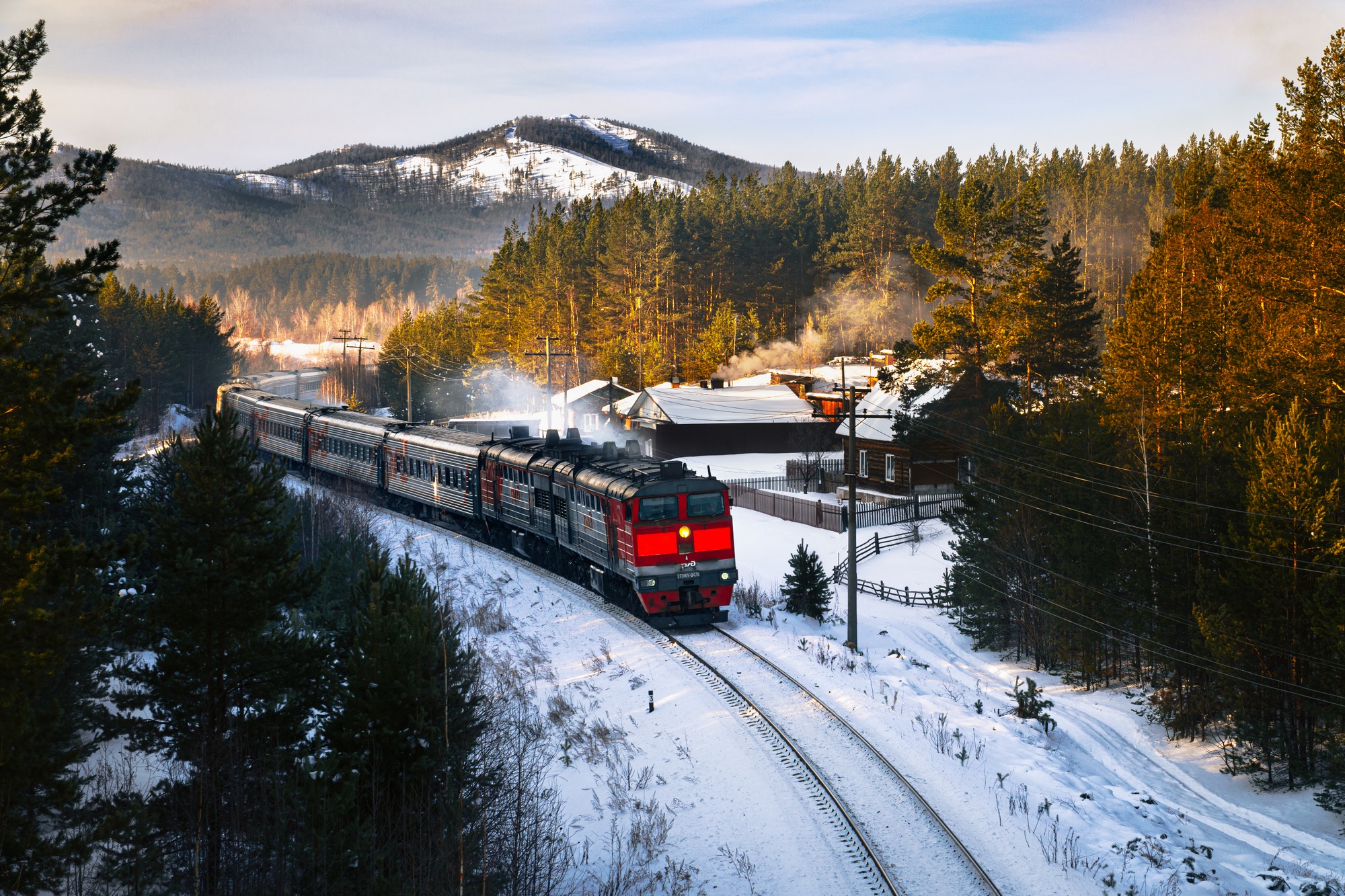 Scenic Winter Journey: HD Train Wallpaper Through Snowy Forest | 2000x1333 | Wallpaper Abyss