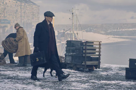 Thomas Shelby from the TV show Peaky Blinders walks a snowy dock with a briefcase — moody 4K Ultra HD PC desktop wallpaper background.