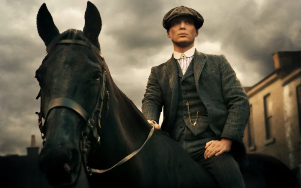 4K TV-show desktop wallpaper: flat-capped man in a period suit riding a black horse beneath stormy skies, Peaky Blinders aesthetic.