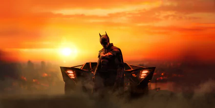 Batman stands in front of the Batmobile at sunset, captured in a detailed 8K Ultra HD wallpaper from the movie The Batman.