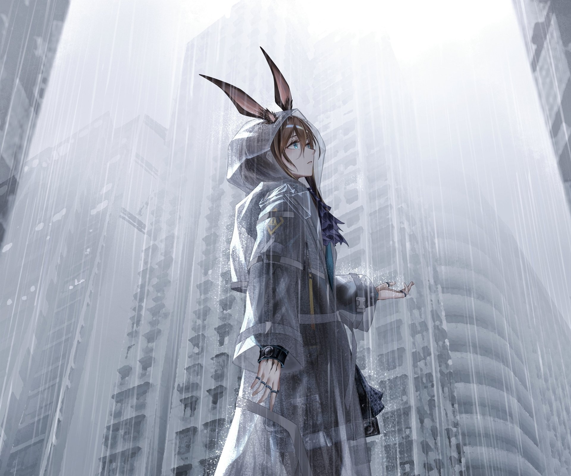 Amiya from the Arknights video game stands in the rain against a blurred city skyline, wearing a hooded coat with rabbit ears — HD PC desktop wallpaper and background.
