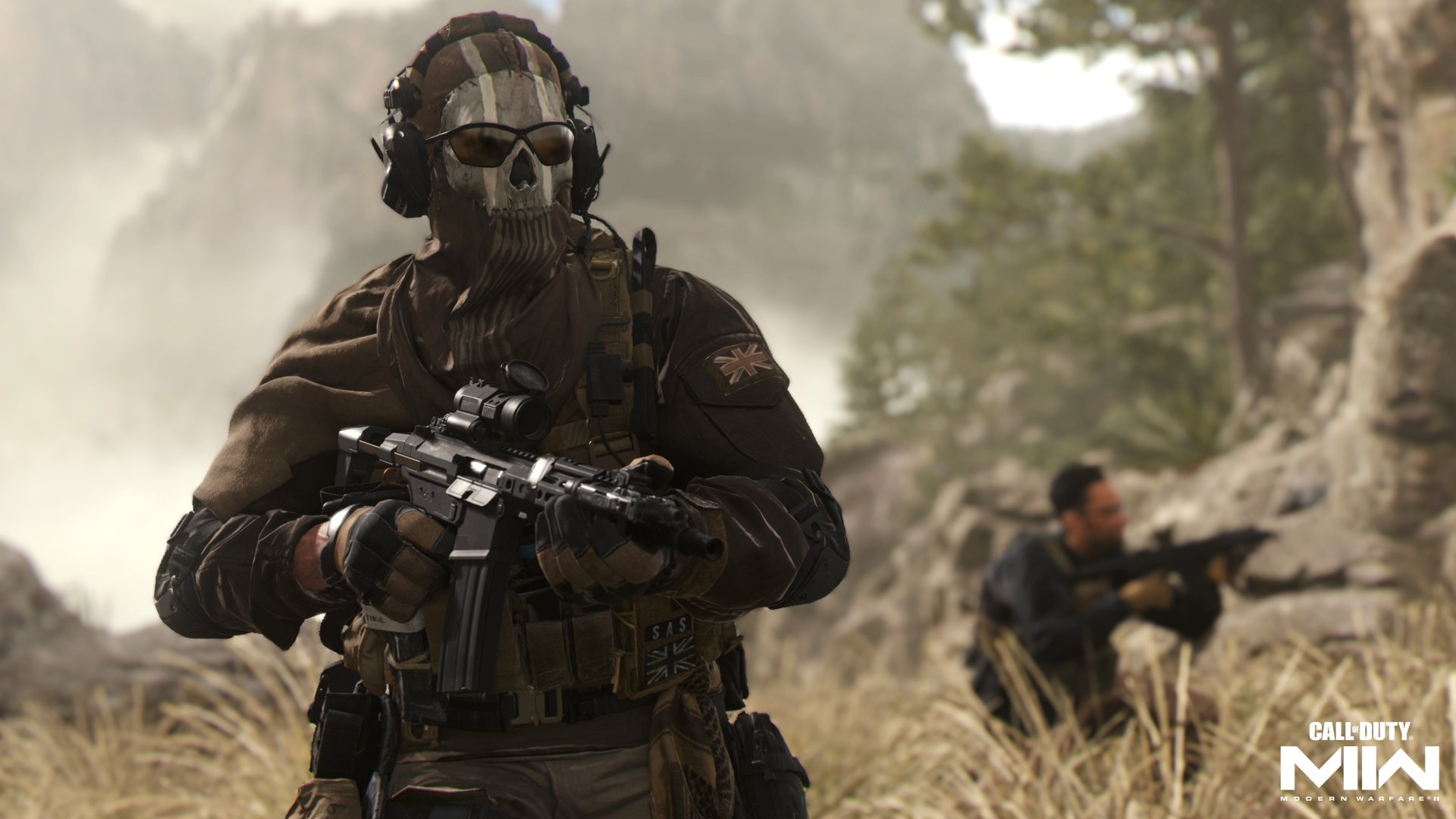 Call of Duty: Modern Warfare II 4K Ultra HD PC desktop wallpaper. Skull-masked operator grips an assault rifle in a grassy, rocky landscape with a crouched teammate behind.