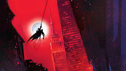HD comic-style Batman desktop wallpaper featuring the Dark Knight swinging through a red-lit cityscape with tall skyscrapers at night.