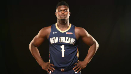 HD desktop wallpaper featuring a basketball player in New Orleans jersey number 1 posing against a dark background.