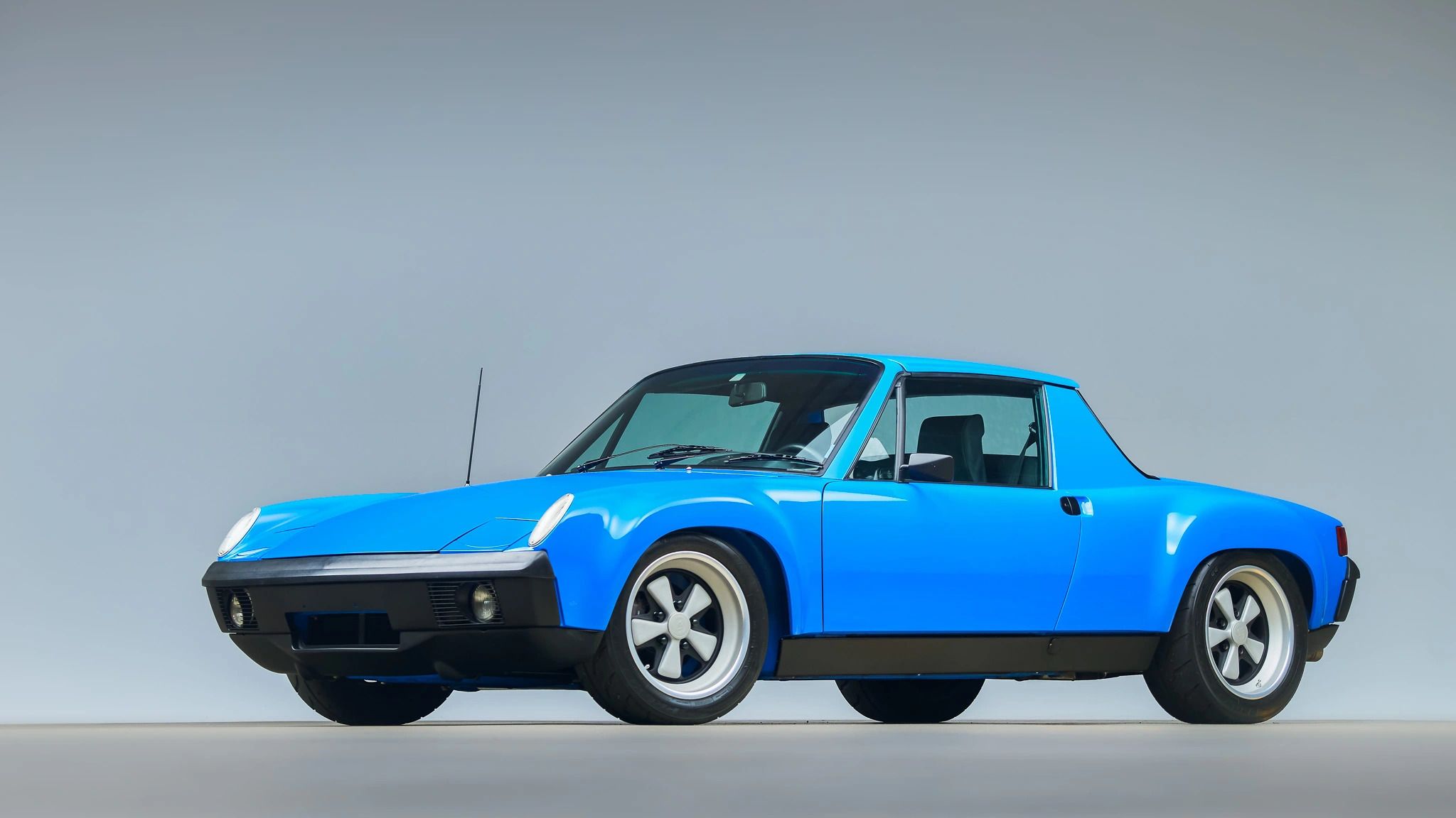 Sleek Porsche 914 convertible showcasing its classic style in a high-definition desktop wallpaper and background.