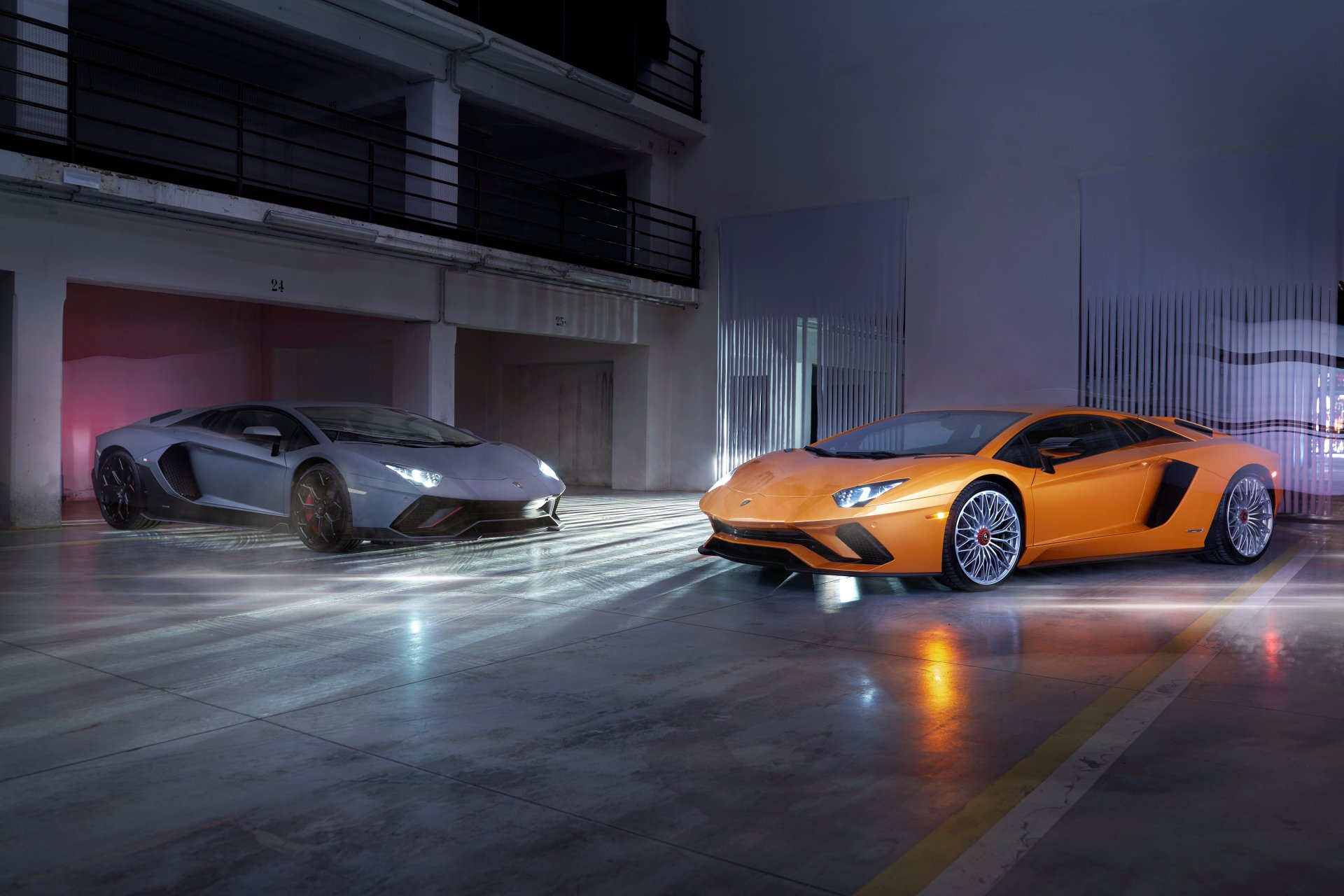 A sleek orange and gray Lamborghini Aventador parked inside a modern garage, captured in sharp detail as a 4K Ultra HD PC desktop wallpaper and background.