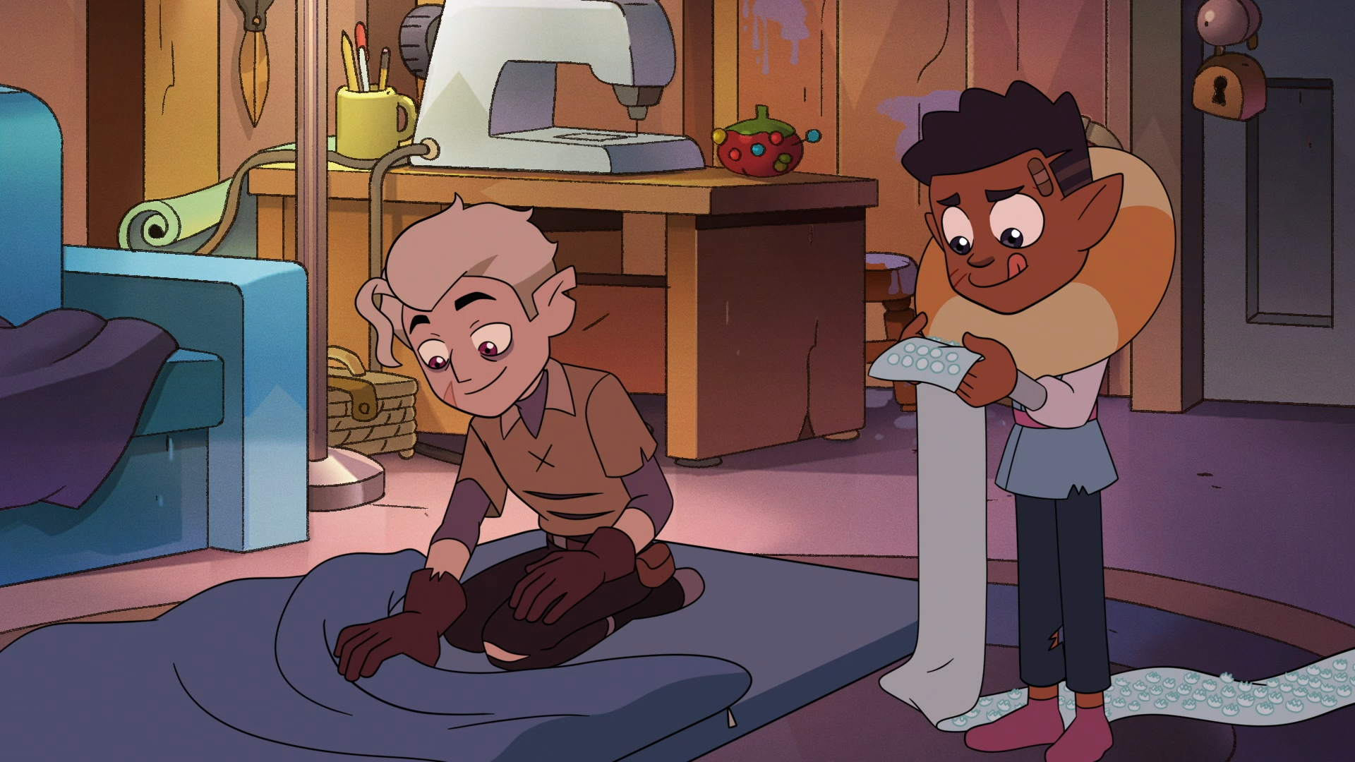 HD PC desktop wallpaper of The Owl House: Gus Porter kneeling on fabric as Hunter measures a long strip near a sewing machine in a cozy craft room.