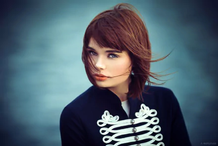 HD PC desktop wallpaper featuring a portrait of a woman with auburn hair wearing a dark jacket with white decorative buttons, tagged Marie Grippon.