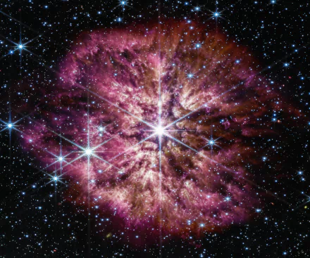 A vibrant 4K Ultra HD sci-fi desktop wallpaper featuring the James Webb Space Telescope with glowing stars and a colorful cosmic nebula.