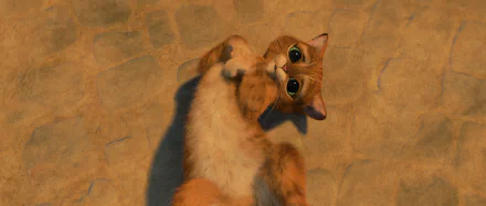 Movie image of Puss in Boots: a cute orange tabby cat lying on its back with big expressive eyes, rendered as a 2K Quad HD PC desktop wallpaper/background.