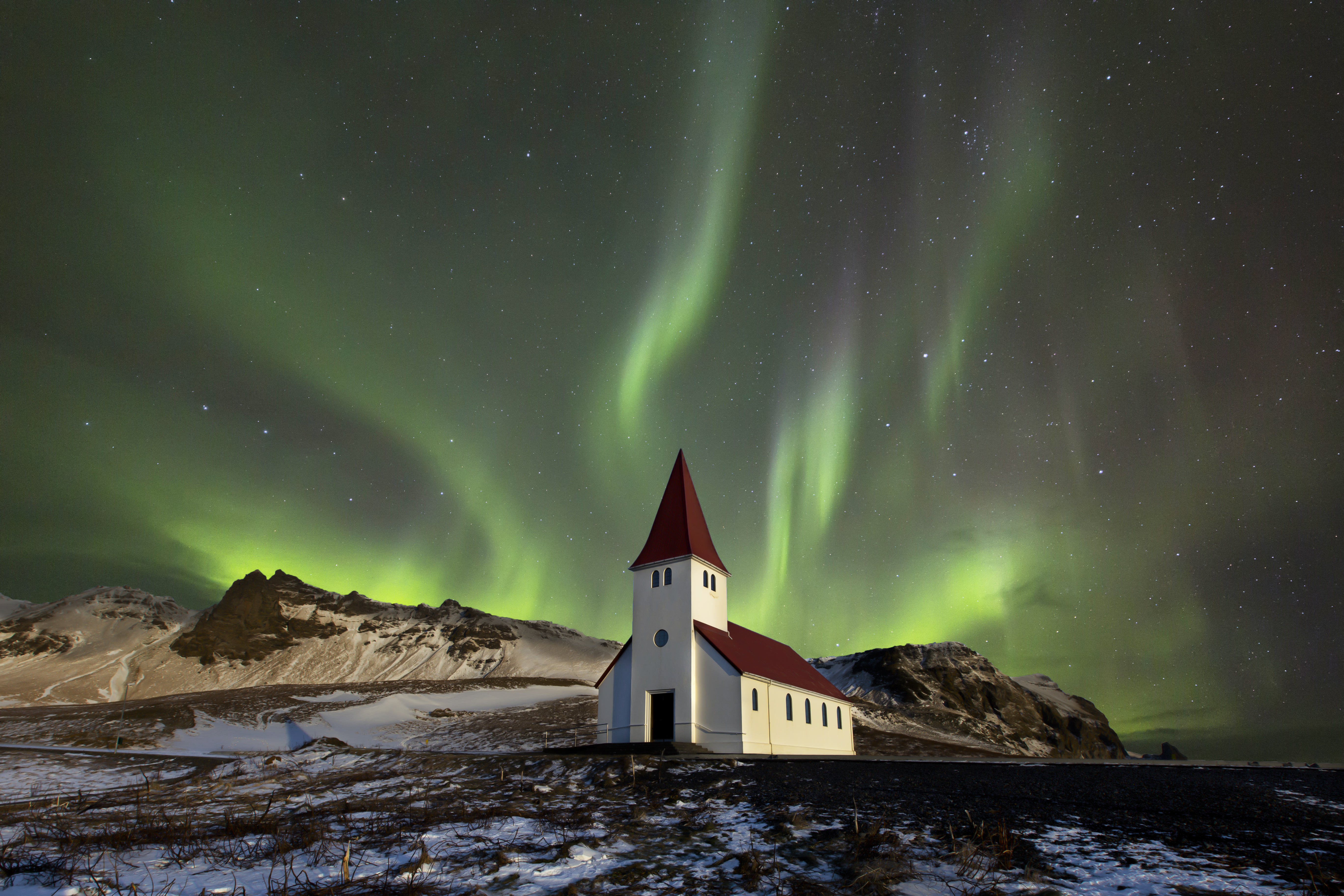 Northern lights (Aurora borealis) over the Víkurkirkja church at Vík í Mýrdal, Iceland by AstroAnthony