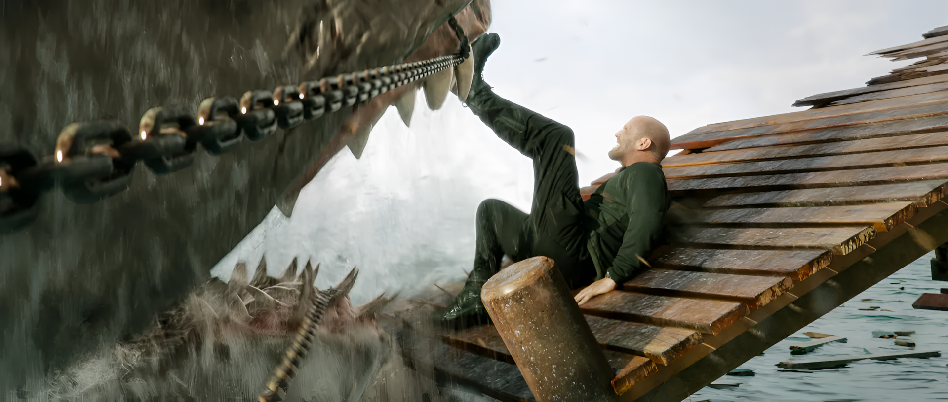 HD desktop wallpaper from Meg 2: The Trench featuring a man on a boat struggling against a gigantic shark.