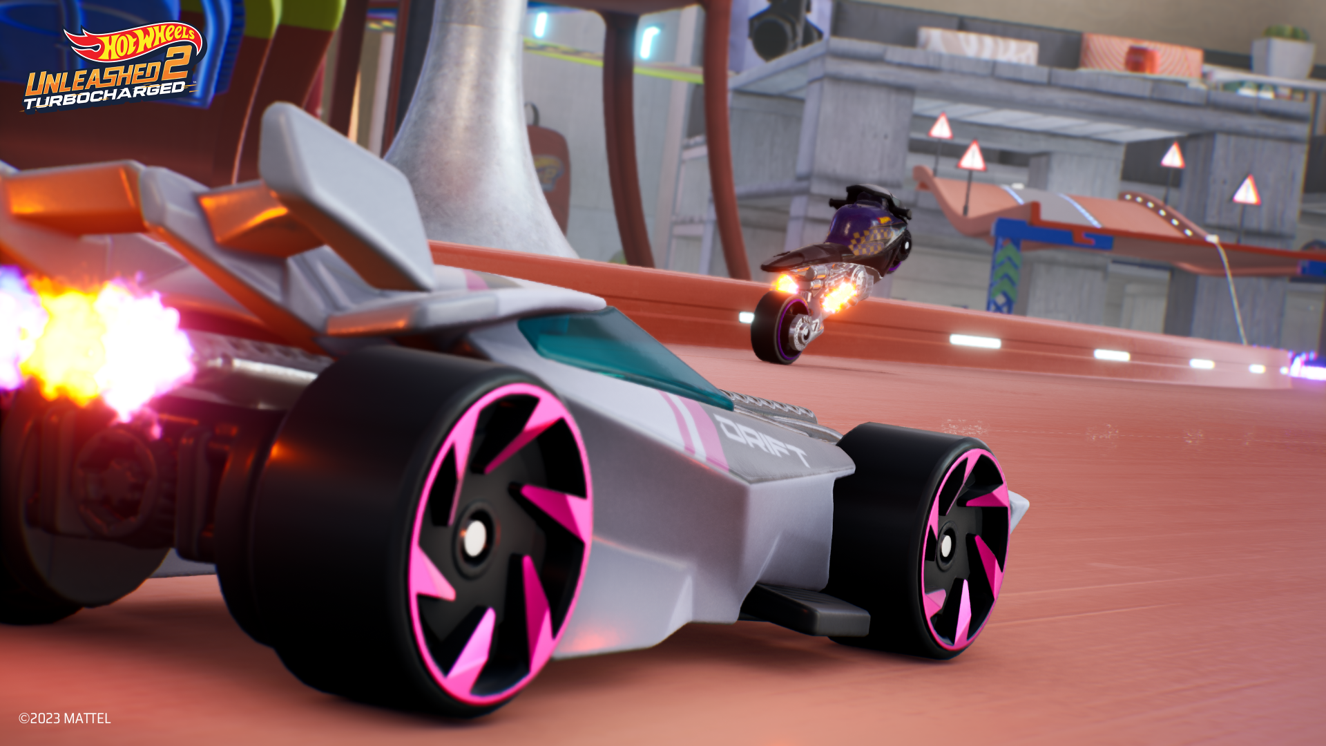 HD desktop wallpaper from Hot Wheels Unleashed 2: Turbocharged featuring two intense racing cars on a dynamic track.