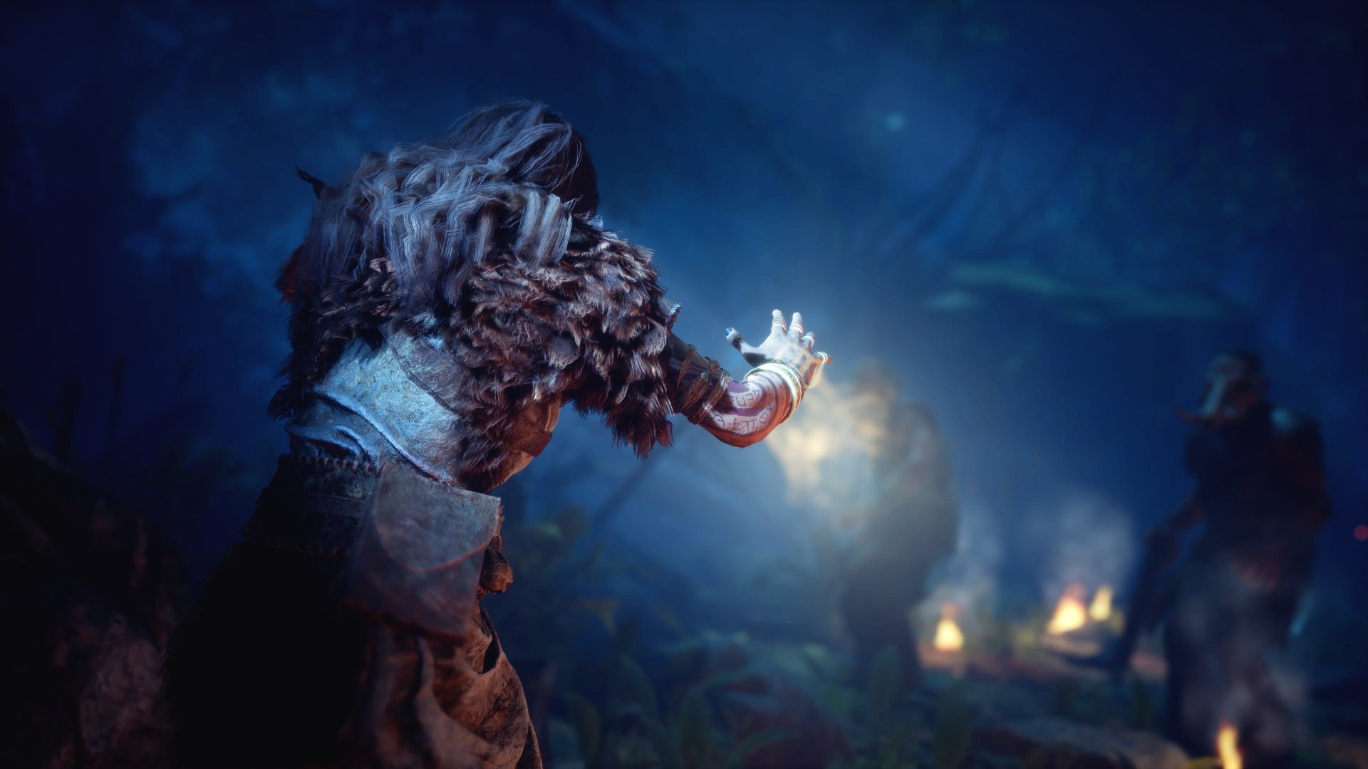 Mystical Gord-themed HD wallpaper featuring a shadowy figure with a feathered headdress holding a glowing artifact in a dark, enchanted forest setting.
