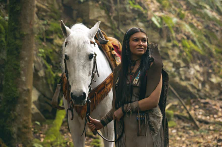 HD desktop wallpaper featuring a character reminiscent of Tiger Lily from Peter Pan standing next to a white horse in a natural, forested setting.