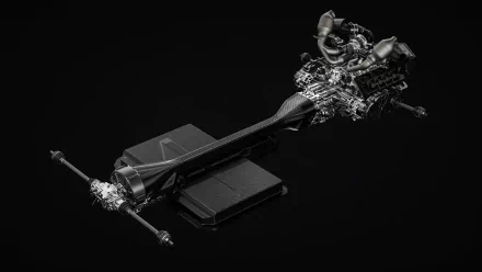 HD desktop wallpaper of a Koenigsegg Gemera's detailed drivetrain components displayed on a black background.