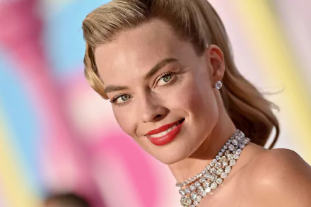 HD desktop wallpaper featuring Margot Robbie, captured in a glamorous look with a dazzling necklace, promoting the movie Barbie (2023).