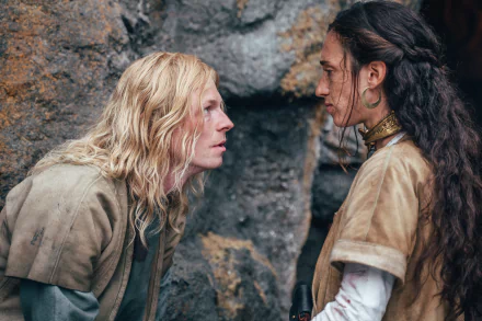 A dramatic scene from the TV show The Winter King, featuring two characters engaged in an intense exchange against a rugged backdrop. High-definition wallpaper for fans.