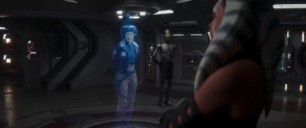 HD wallpaper featuring Ahsoka Tano observing a hologram of Hera Syndulla with a droid in the background.