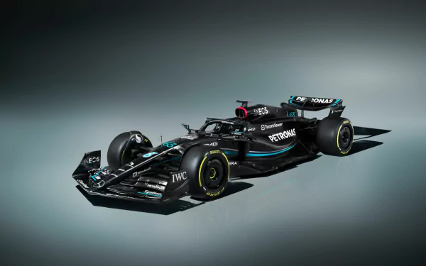 HD wallpaper of the Mercedes W14 Formula 1 car, showcasing its sleek design and branding details on a dark background.