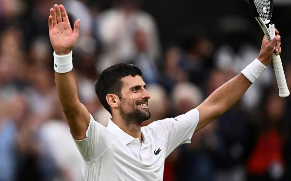 Novak Djokovic celebrates a victory at Wimbledon 2023, showcasing his passion for tennis. This vibrant HD wallpaper captures the essence of sports excellence.