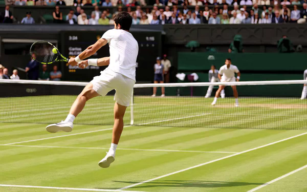 Tennis player in action at Wimbledon 2023 on a grass court for HD desktop wallpaper and background.