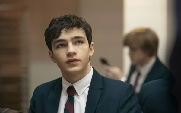 Young actor wearing a suit in HD desktop wallpaper.