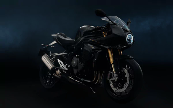 Triumph Speed Triple 1200 RR Bond Edition showcased in an HD desktop wallpaper, featuring a sleek black design against a dark background, highlighting its sporty elegance.
