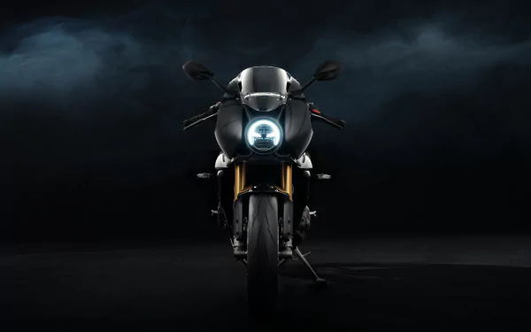Triumph Speed Triple 1200 RR Bond Edition motorcycle showcased in an HD desktop wallpaper with a dark, moody background highlighting its sleek design.