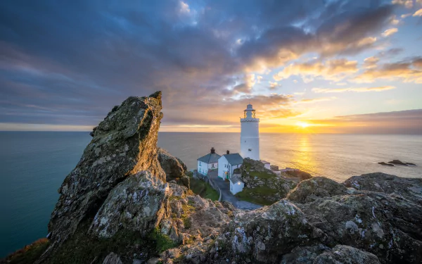 A striking HD desktop wallpaper featuring a majestic man-made lighthouse against a breathtaking backdrop.