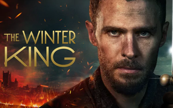 HD desktop wallpaper featuring Iain De Caestecker in The Winter King with a fiery battlefield background.