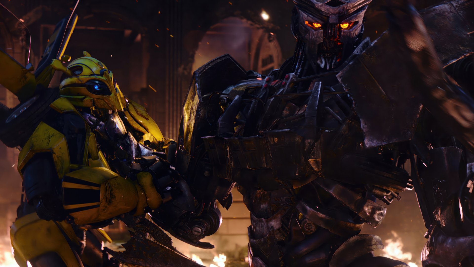 HD wallpaper from Transformers: Rise of the Beasts, featuring Bumblebee and an imposing robotic antagonist amidst fiery chaos.