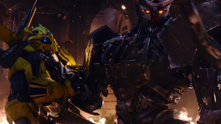 HD wallpaper from Transformers: Rise of the Beasts, featuring Bumblebee and an imposing robotic antagonist amidst fiery chaos.