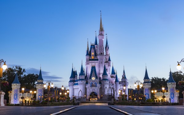 HD desktop wallpaper featuring the iconic Cinderella Castle at Walt Disney World during twilight, with a clear view of its fairy tale spires and serene surroundings, perfect for a magical background.