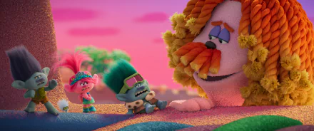 HD wallpaper of colorful Trolls characters banding together for desktop background, with vibrant pink skies and textured landscape.
