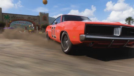 HD PC desktop wallpaper featuring a dynamic orange car racing through a dirt track in the video game Forza Horizon 5.