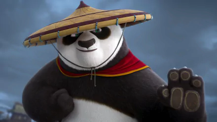 Po from Kung Fu Panda 4 strikes a confident pose, wearing a wide-brimmed hat and red cape. This vibrant HD wallpaper showcases his dynamic character.