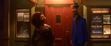 A vibrant HD wallpaper from the movie Soul (2024), featuring two animated characters in front of a red door, set against a warm, inviting atmosphere.