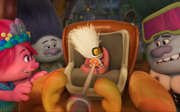 A vibrant HD desktop wallpaper from Trolls Band Together, featuring colorful Troll characters interacting with a quirky, anthropomorphic object in a cozy setting.