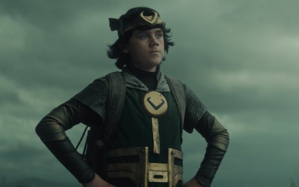 HD desktop wallpaper featuring the character Loki in costume with a dramatic sky in the background.