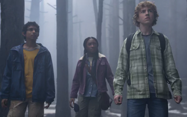 HD desktop wallpaper featuring three characters from the Percy Jackson and the Olympians TV show, exploring a misty forest scene.