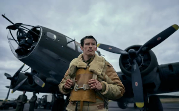 A character stands confidently in front of a WWII-era bomber aircraft, capturing the spirit of the TV show Masters of the Air. This HD desktop wallpaper features a dramatic sky backdrop.